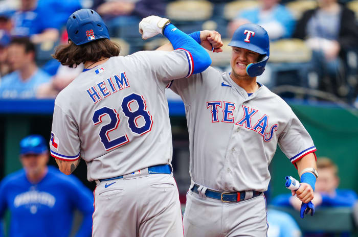Apr 19, 2023; Kansas City, Missouri, USA; Texas Rangers catcher Jonah Heim (28) celebrates with third baseman Josh Jung (6) after hitting a home run during the ninth inning against the Kansas City Royals at Kauffman Stadium. Mandatory Credit: Jay Biggerstaff-USA TODAY Sports